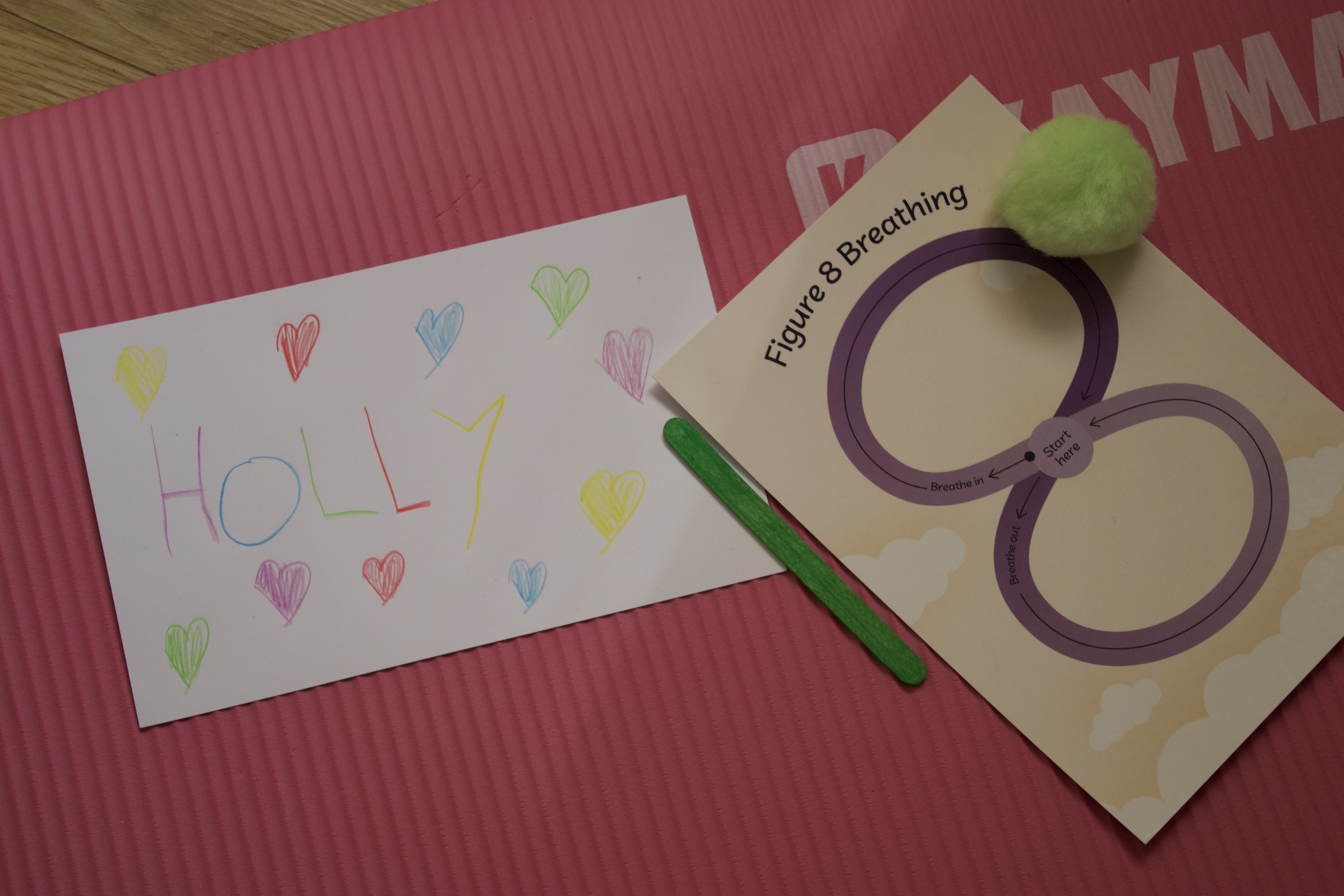 Create and Calm — name card and breathing exercise on yoga mat